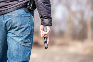 Close-Up of Man Holding .45 Caliber Handgun